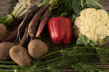 Still life composed of potatoes, red bell pepper, fennel, spring onion, cauliflower and carrots on...