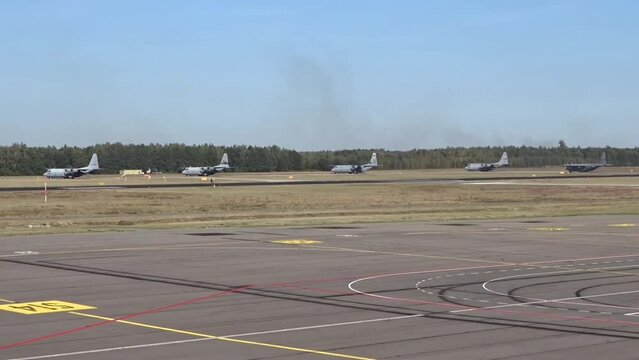 Military Airplanes Taxiing at Air Base