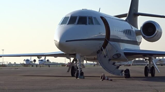Private Business Corporate Executive Jet Parked at Airport with door open