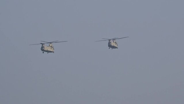 Army Air Force Military Heavy Helicopters approaching air base