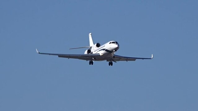 Business Aircraft Jet Private Executive Corporate Slow Motion Landing Final Approach into Airport Airfield arrival arriving