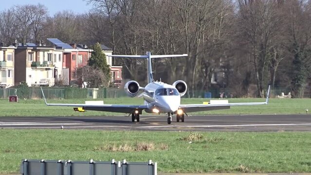 Business Private Corporate Executive Jet Taxiing and Turning off the Runway after landing at International Airport.