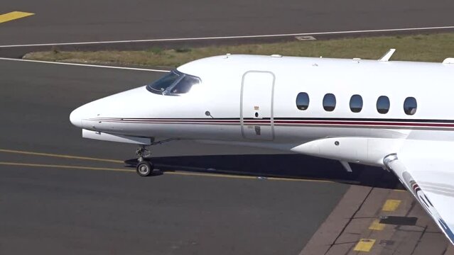 Private Jet Departing at Airport Close Up Taxiing