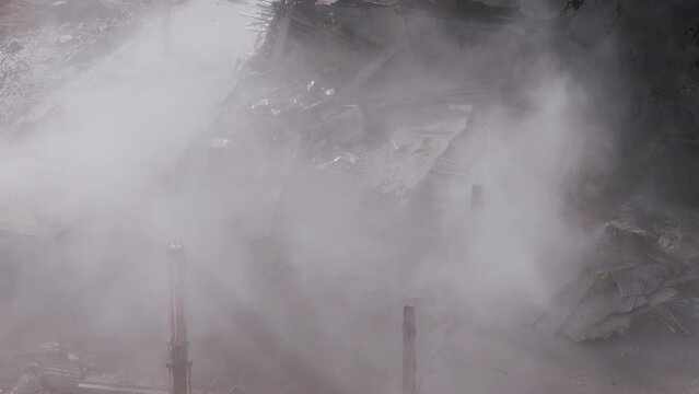 Digger working in a demolition site. Aerial view