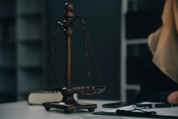 Business and lawyers discussing contract papers with brass scale on desk in office. Law, legal...