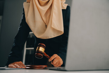 Business and lawyers discussing contract papers with brass scale on desk in office. Law, legal services, advice, justice and law concept picture with film grain effect
