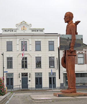 Assen, Netherlands - Oct 11 2023 A giant statue of Vincent Van Gogh has been placed in Assen. In the background a building with the name 'Het Wapen van Drenthe' This was a hotel, build in 1780