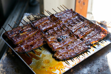 Grilled smoked eel is the most traditional food in Narita, Chiva, Japan.
