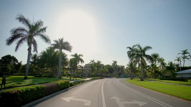  POV Wde view of car driving on street in Naples Florida. road with cars in traffic 