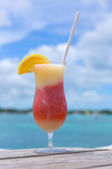 Travel background with drinks Bocal on Caribbean beach.