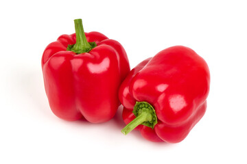 Red ripe bell peppers, isolated on white background.