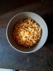 Cooked instant noodles in a soup bowl