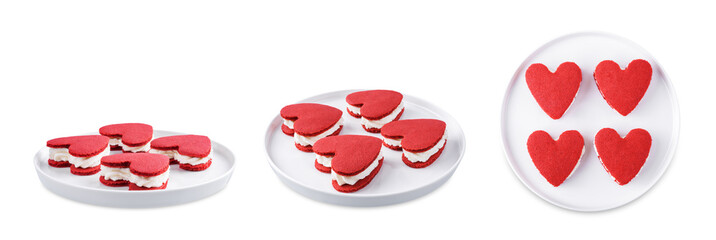 Red velvet whoopie pies in the form of heart for Valentine's day in a plate on a white isolated background