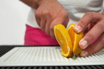 An slice of orange being cut