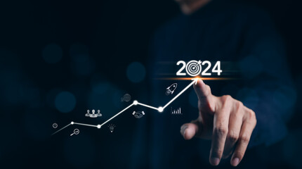 The 2024 new year business goals concept. Businessman touching increase arrow graph company future growth 2024. Business plan target strategy, Planning and challenge business strategy in new year, - obrazy, fototapety, plakaty