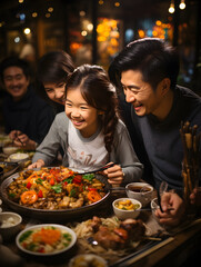 A cheerful family moment as they savor a Chinese New Year's feast illuminated by festive lanterns.