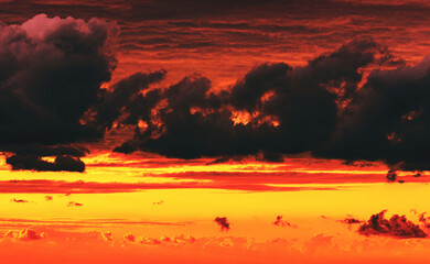 dramatic cloudy sky at fiery sunset