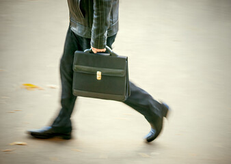 businessman at blurry walking, autumn