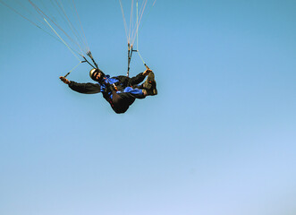 paragliding pilot in the air