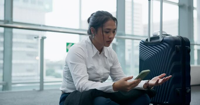 Woman, phone and delay time at an airport while exhausted, angry and tired of waiting. Travel luggage, late and upset asian person stress with a smartphone and watch to check boarding schedule