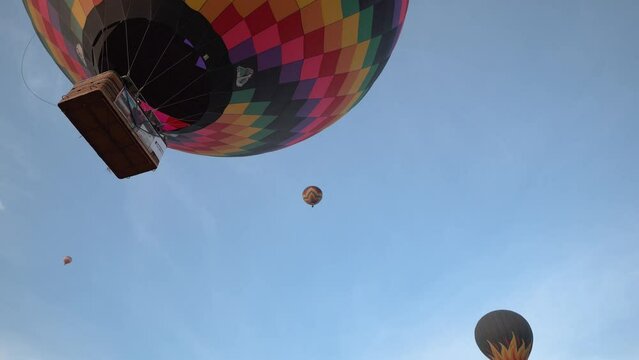 Hot air balloons flying during a beautiful sunrise in the Serra da Canastra mountains in Minas Gerais, southeastern state of Brazil