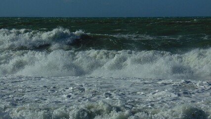Rough blue sea and foamy waves from the November swells of the Mediterranean