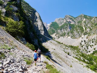 Fototapeta premium Family hiking to Sopoti Waterfall, Albania.