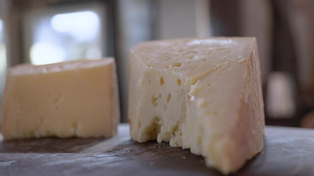 A piece Serra da Canastra Cheese that was cured in a cellar of a Brazilian Farm