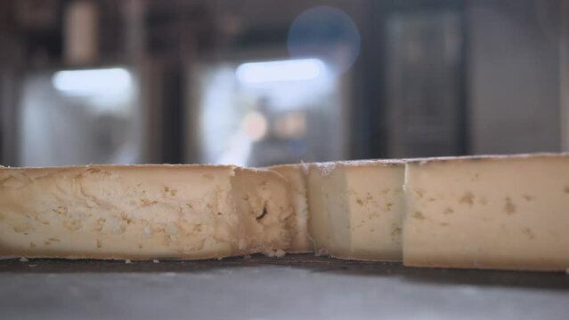 A piece Serra da Canastra Cheese that was cured in a cellar of a Brazilian Farm