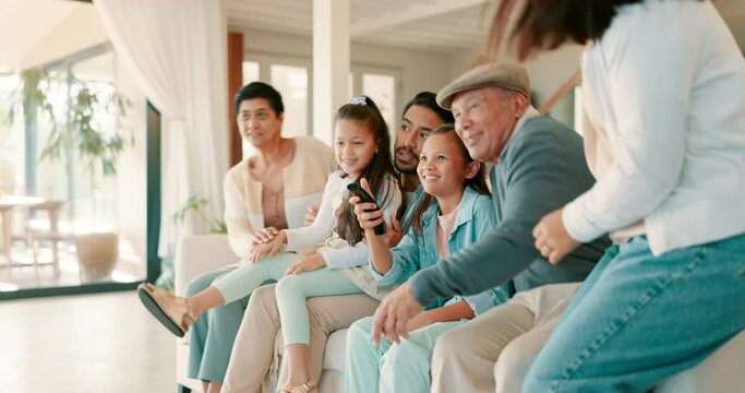 Happy, big family and watching tv on sofa together in living room, men and women with kids in home. Movies, bonding and grandparents, parents and children on couch to get watch video on television.