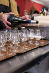 Many small tasting glasses of sparkling wine champagne on winter festival in December, Avenue de Champagne, Epernay, Champagne region, France