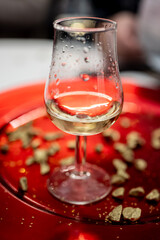 Small tasting glass of sparkling wine champagne on winter festival in December, Avenue de Champagne, Epernay, Champagne region, France
