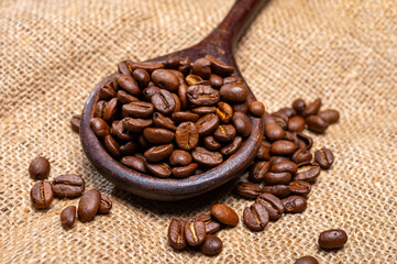 Fototapeta premium Arabica brown roasted coffee beans from Africa coffee producing region, cultivating in Ethiopia, Ivory Coast, Uganda, Kenya, Rwanda and Tanzania