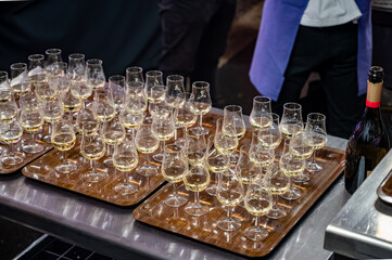 Many small tasting glasses of sparkling wine champagne on winter festival in December, Avenue de Champagne, Epernay, Champagne region, France
