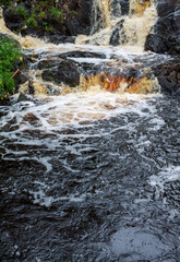 Descending water from the mountains in the river, fast cold water