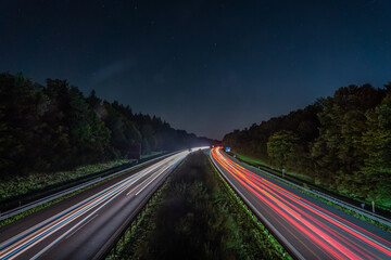 Starry night over a bustling highway in motion
