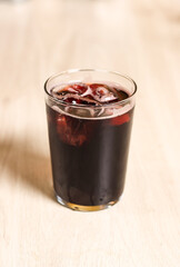 A glass of calimocho, coca-cola with wine, with ice, typical of Spain