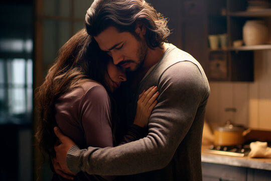 Family couple in arms and grief crying . A loving couple in each other's arms are crying and comforting each other through a shared loss