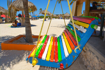 Colourful Arashi beach scene. Holiday vibes in Aruba Caribbean sea. 