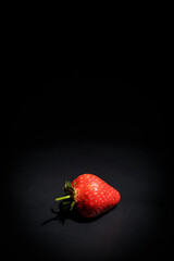 Fresh red strawberries on a black background