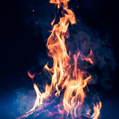 Fire flames on a black background, motion blur, abstract art, toned