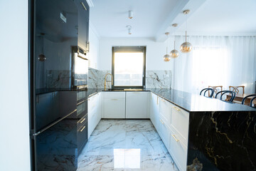 white and black modern kitchen room with bar counter