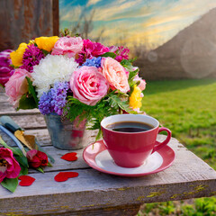 copy space on a Beautiful valentine composition spring flowers and cup of coffee outside