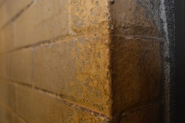 chipped painted brick wall corner