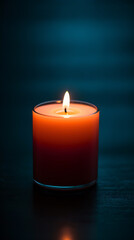 Fototapeta na wymiar A candle with a flame in a glass