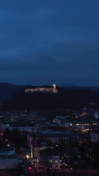 Ljubljana City Center at Night. Slovenia, Europe. Aerial View. Orbiting. Vertical Video
