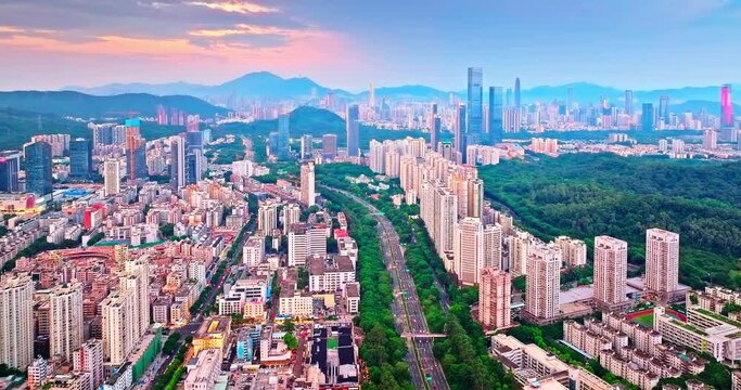Aerial shot of Shenzhen city skyline and roads in Guangdong province, China. Creative category video without architectural logos