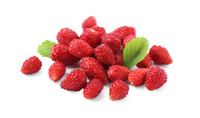 Ripe wild strawberries and green leaves isolated on white