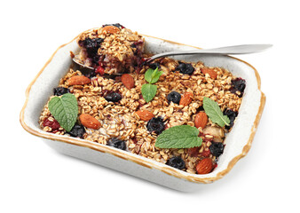 Tasty baked oatmeal with berries and almonds in baking tray isolated on white