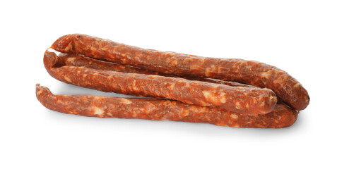 Thin dry smoked sausages isolated on white